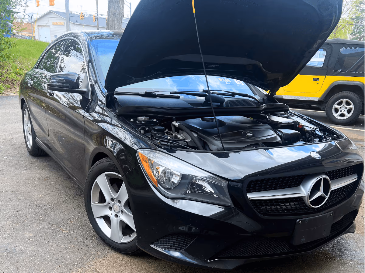 Auto repair vehicle with hood open